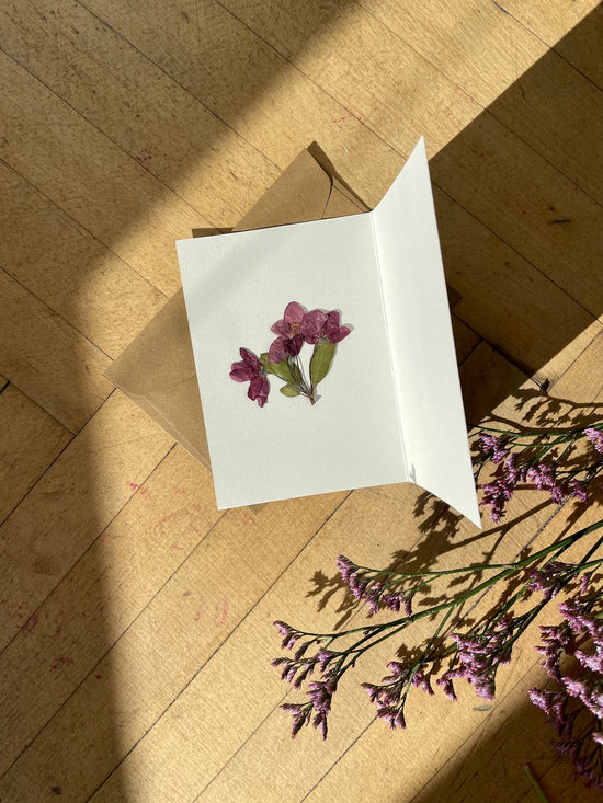 Greeting card with pressed cherry